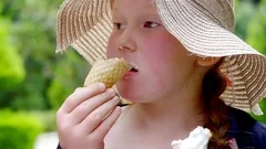 a funny girl eating rice with meat sitti... | Stock Video | Pond5