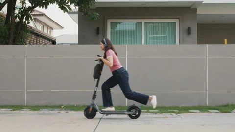 Funny riding e-scooter eco friendly lifestyle fun crazy smart life. Stock Footage 232648530