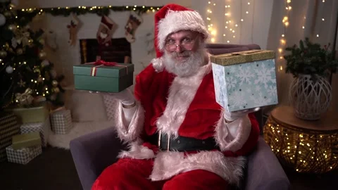 Funny Santa Claus Gift Boxes With Christmas Presents. Choosing New Year Gifts Video stock 142809580