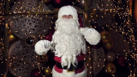 Funny Santa Claus is talking to the camera, wishing Merry Christmas and Happy Stock Footage 166904945