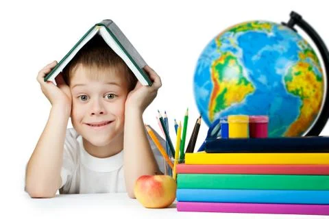 Funny schoolboy with a book on her head. isolated Stock Photos
