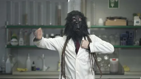 Funny Scientist with a Gorilla Monkey mask in the lab Stock Footage 153101325
