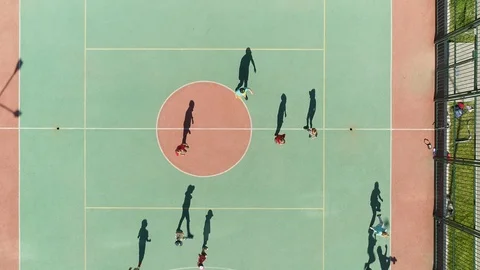 Funny shadow boys moving drone children play soccer sports team on field 4K. Stock Footage 121326910