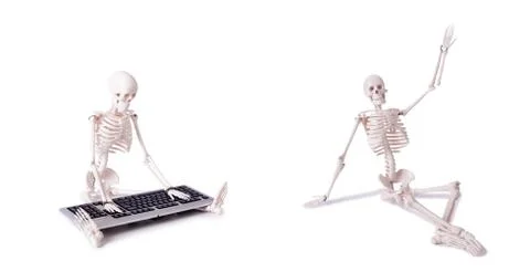 Funny Skeleton working on computer Stock Photos