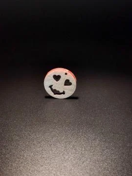 Funny smiley face on a black background Stock Photos