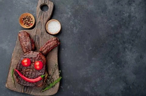 Funny smiley face made with ground beef and vegetables Stock Photos