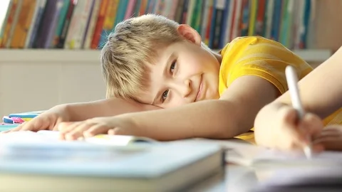  Funny smiling elementary school student.  Stock Footage 87611591