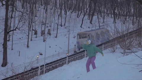 Funny Snowman Guy Drinks Vodka Near The Cable Train, Funicular, On Video stock 128578381