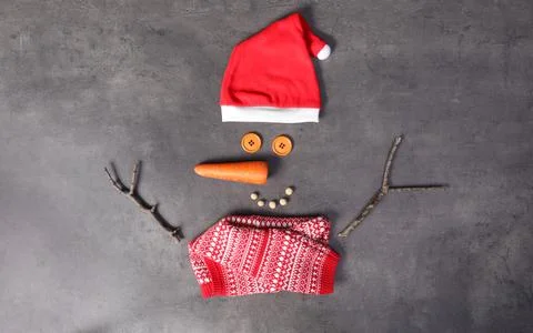 Funny snowman made with different elements on grey background, flat lay Stock Photos