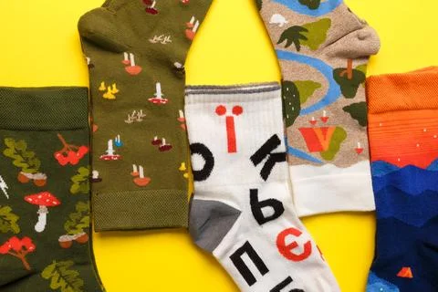 Funny socks with mushrooms, camping pattern and Ukrainian alphabet designs Stock Photos