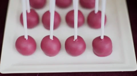 Funny sweet round candy on a stick on table Stock Footage 56058124