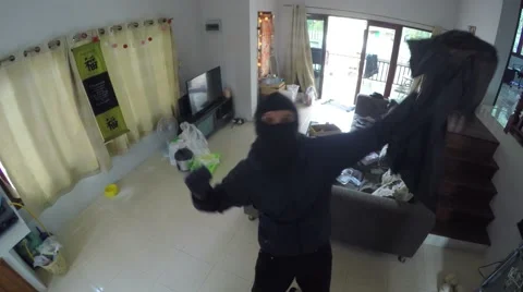 Funny Thief Dancing in Front Of Camera While Stealing House Stock-Footage 67482743
