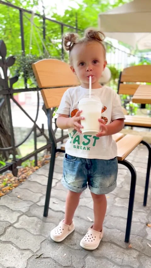 Funny toddler with milkshake Stock Footage 315203110