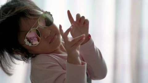 Funny toddler posing with sunglasses Stock Footage 159485463