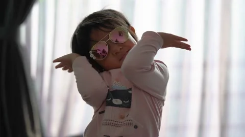 Funny toddler posing with sunglasses Stock Footage 159485492