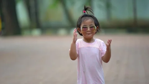 Funny toddler posing with sunglasses Stock Footage 159485751