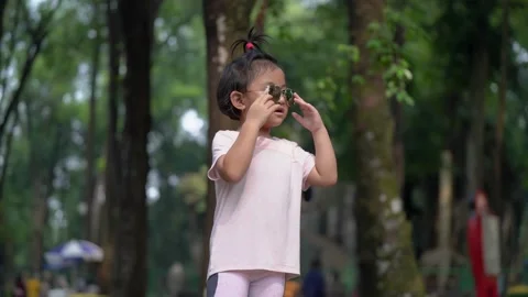 Funny toddler posing with sunglasses Stock Footage 159485796