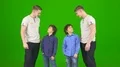 The funny twin brothers stand on the green background 4k or 4k+ Resolution