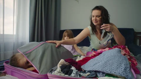 Funny video of packing a suitcase for a trip to the sea with children. Stock-Footage 250453039