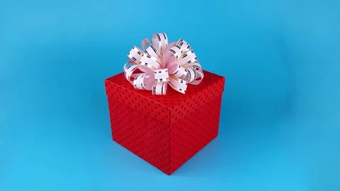 Funny white rabbit with pink bow, opening present box Stock Footage 71202337