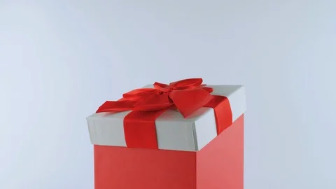 Funny white Rabbit, in red gift box with a bow, stands up on two legs Stock Footage 103509170