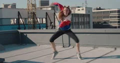 funny woman dancing on rooftop celebrati... | Stock Video | Pond5