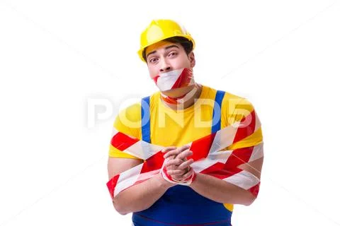 Funny worker wearing coveralls with tape Stock Photos