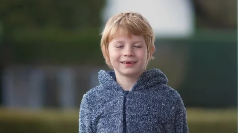 Funny young boy in bear suit has fun on camera. Stockbeeldmateriaal 122052095