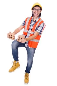 Funny young construction worker with broken brick isolated on white Stock Photos