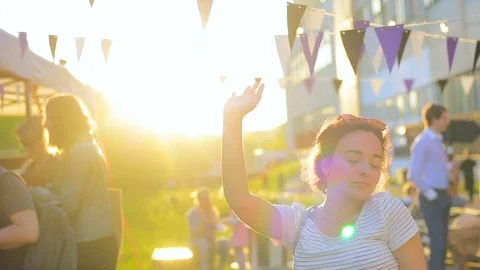 Funny young couple having fun dancing on a picnic against the sun Stock Footage 78409009