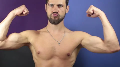 A funny young guy with a naked torso sho... | Stock Video | Pond5