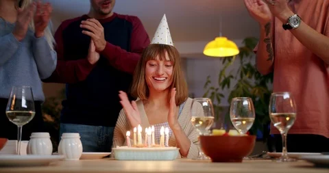 Funny young Hispanic man congratulating girlfriend and friends clapping hands at Stock Footage 123668137
