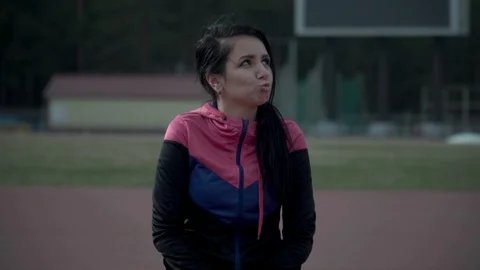 Funny young woman in a tracksuit laughs Vídeo Stock 89680153