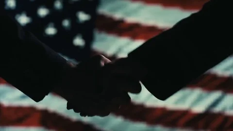 Funy Handshake. Multiple takes. USA flag on LED background. Stock Footage 81016081