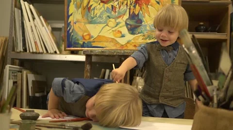 Funy twins boys 2 years old at drawing lesson Stock Footage