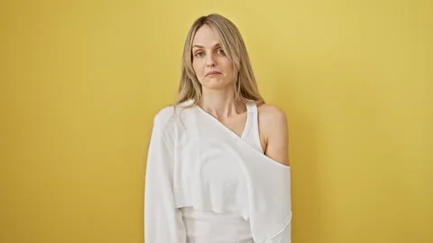 Furious blonde bombshell letting it all out! young woman screaming, shout e.. Stock Footage 268591482