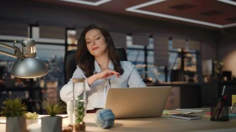 Furious boss hitting table feeling nervous at night agency. Lady find mistake Stock Photos
