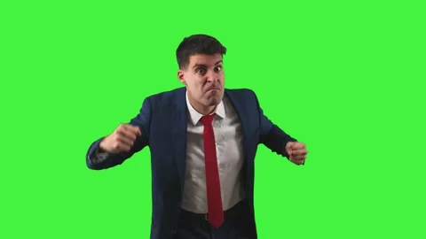 Furious Businessman Glaring at Camera with Clenched Fists white background .. Stock Footage 272832035