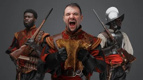 Furious conquistador explorer with map with two comrades Fotos Stock