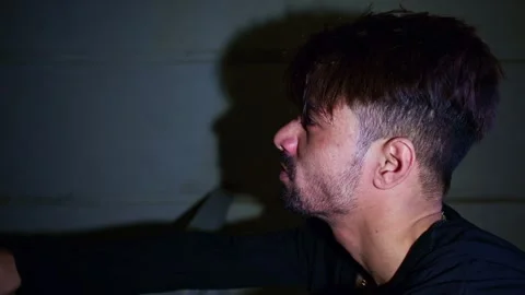 Furious guy stands on balcony lost in thought Stock Footage 302072316