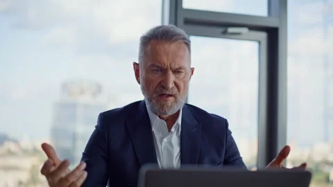 Furious investor gesturing laptop webcam complaining on report in office closeup Stock Footage 319963564