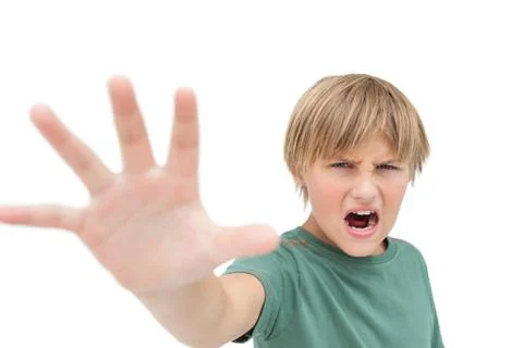 Furious little boy shouting and making stop sign with hand Stock Photos