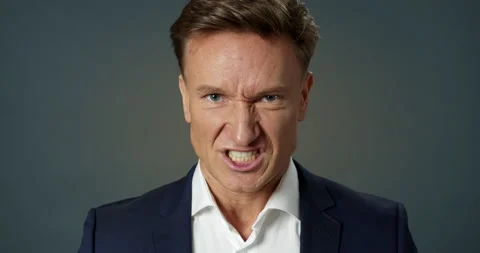 Furious Look Close-up Man Face. Fierce Businessman Looking at Camera Baring His Stock Footage 155127510