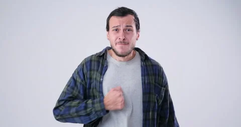 Furious Man hits himself on the chest Stock Footage 143941799