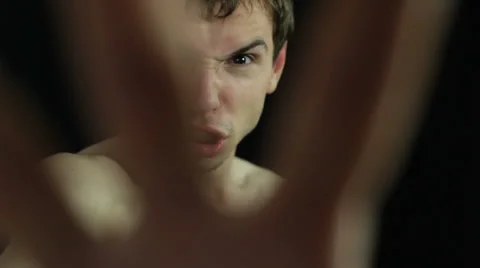 Furious naked man gesturing 库存影片 23950221