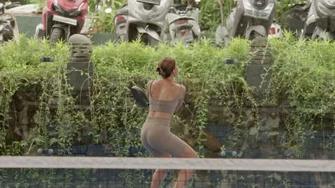 Furious padel tennis player serving ball slow mo. Woman play tennis game court. Stock Footage 237519441