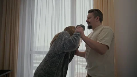 Furious woman physically attacking her partner during a fight at home Stock Footage 327870901