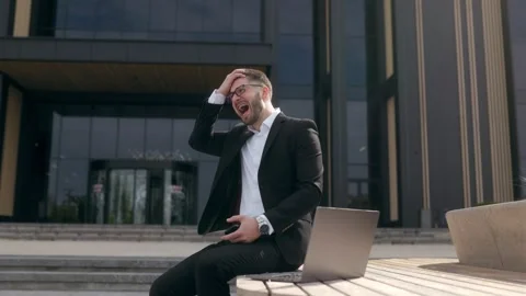 Furious Young Executive Yelling in Frustration Over Bad News Stock Footage 286138099
