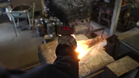 Furnace glowing with fire preparing molten metal for cast iron pouring process Vídeos de archivo 345047337