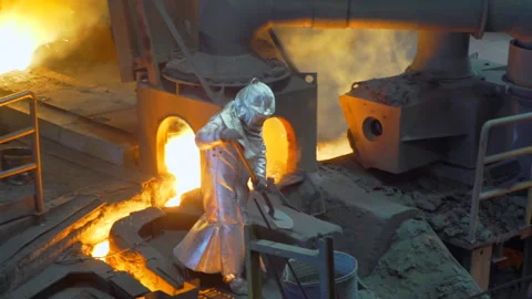 Furnace molten cast iron inside factory - industry - man working Stock Footage 249621004